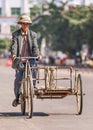 Chinese senior on a rusty tricycle, Lishui, Hainan Island, China